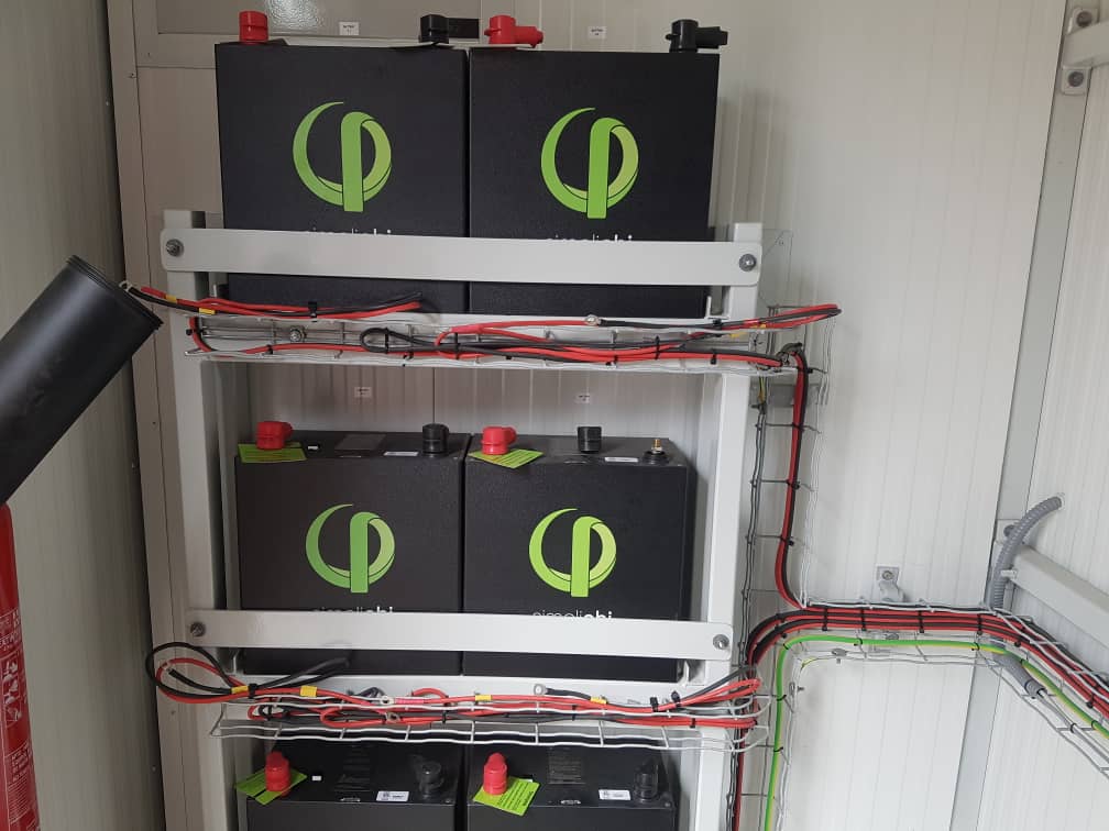 Battery bank racked inside a containerised plant