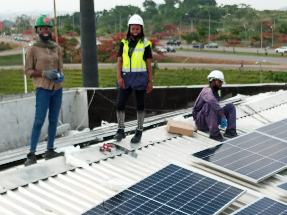 DORMIC engineers on a rooftop before panel installation